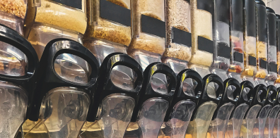 many food dispensers lined up next to each other